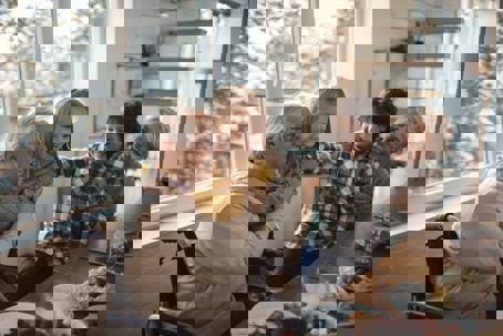 warm, joyful family moment indoors during what appears to be a winter day