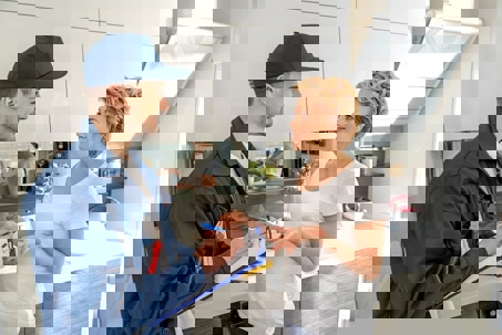 Woman talkiing to the technician