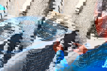 technician fixing the compressor