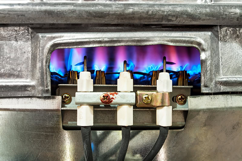 close-up of a furnace pilot-light.