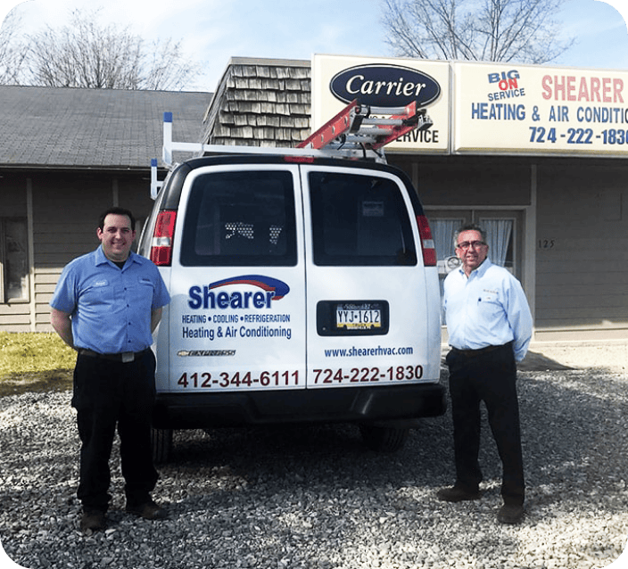 Shearer Heating, A/C & Refrigeration employees standing in front of HVAC service van at Washington, PA.
